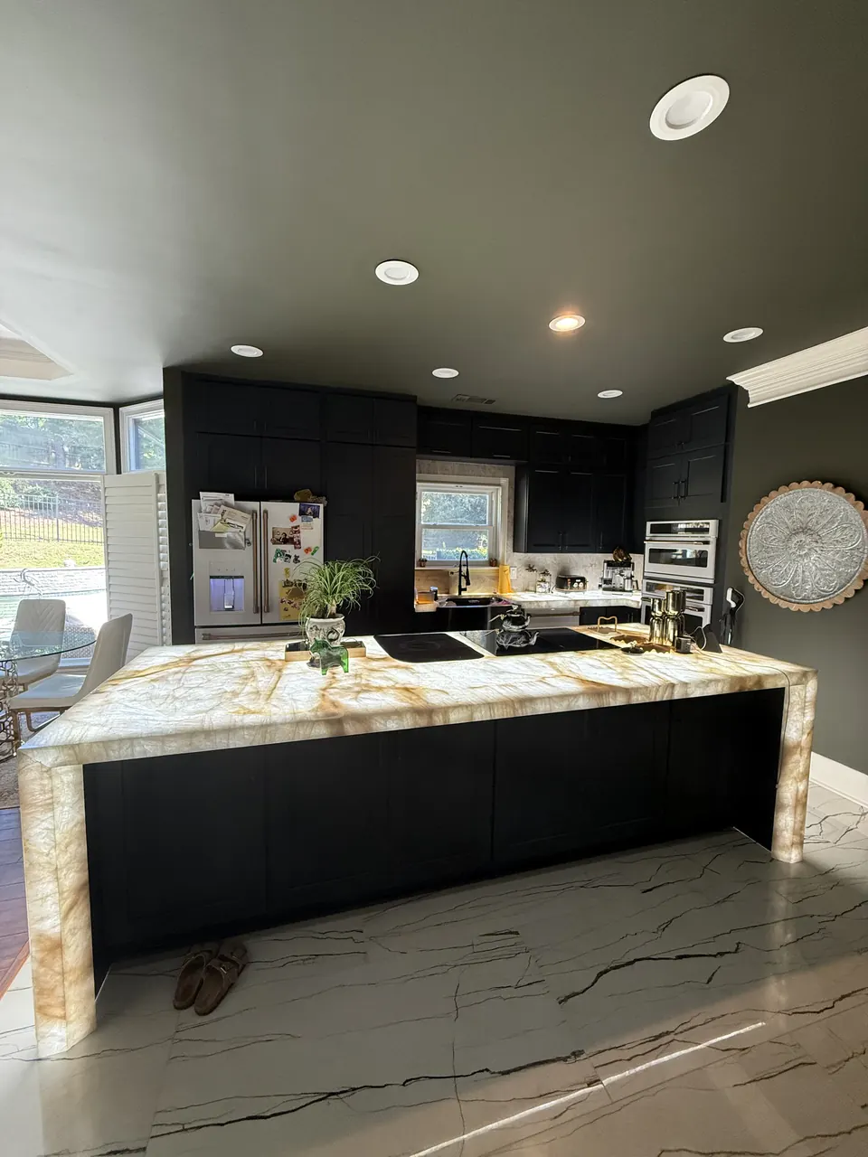 Backlit Stone & Dark Cabinetry — after view 1