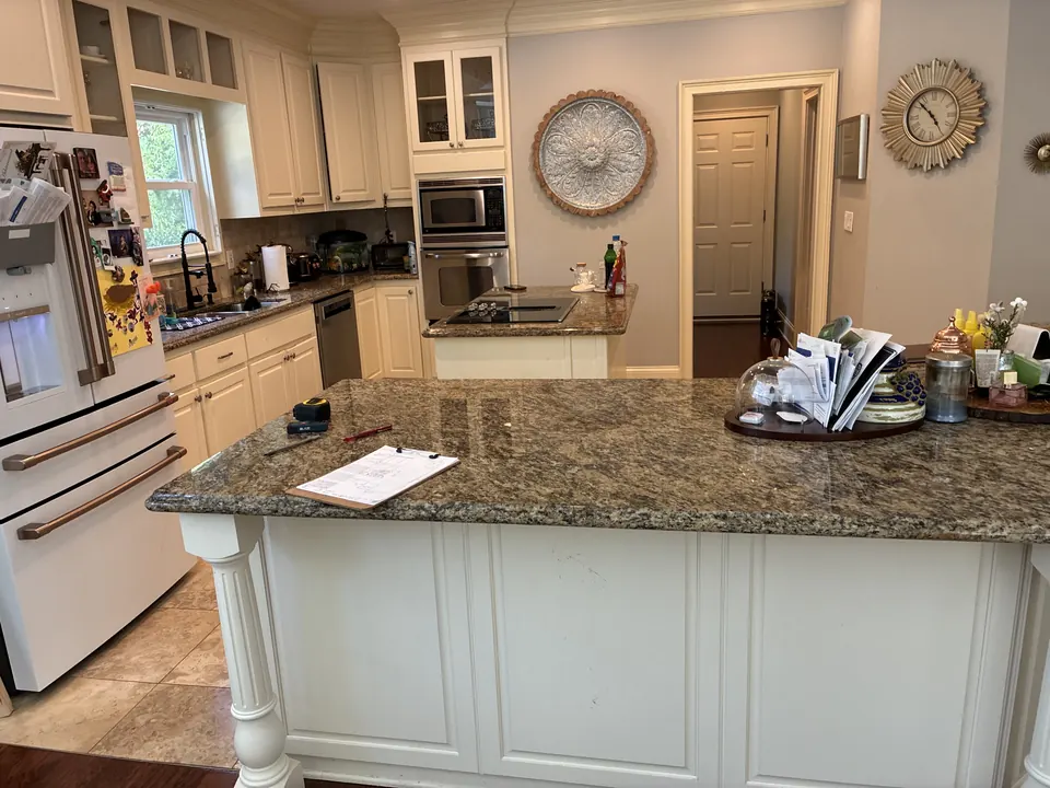 Backlit Stone & Dark Cabinetry — before view 1