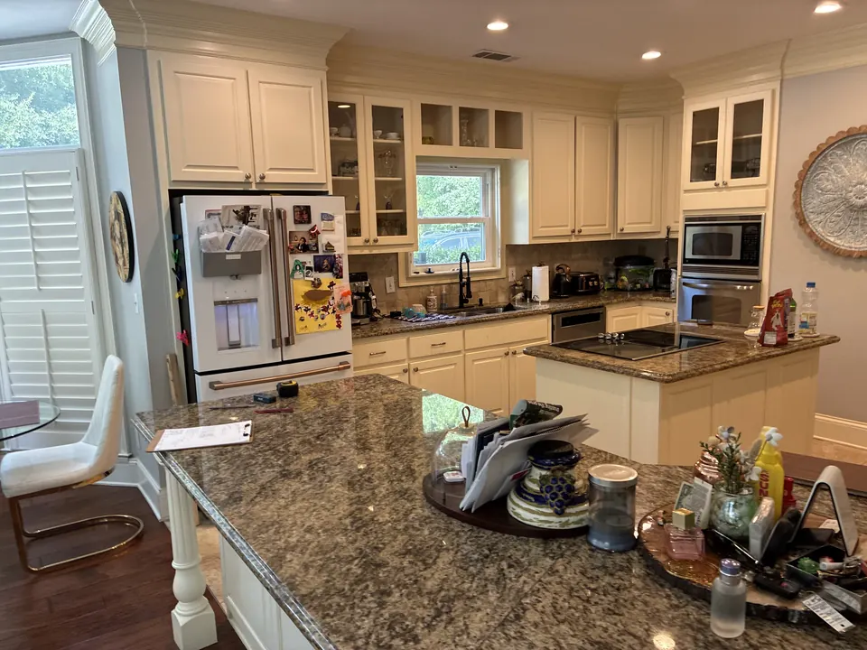 Backlit Stone & Dark Cabinetry — before view 2